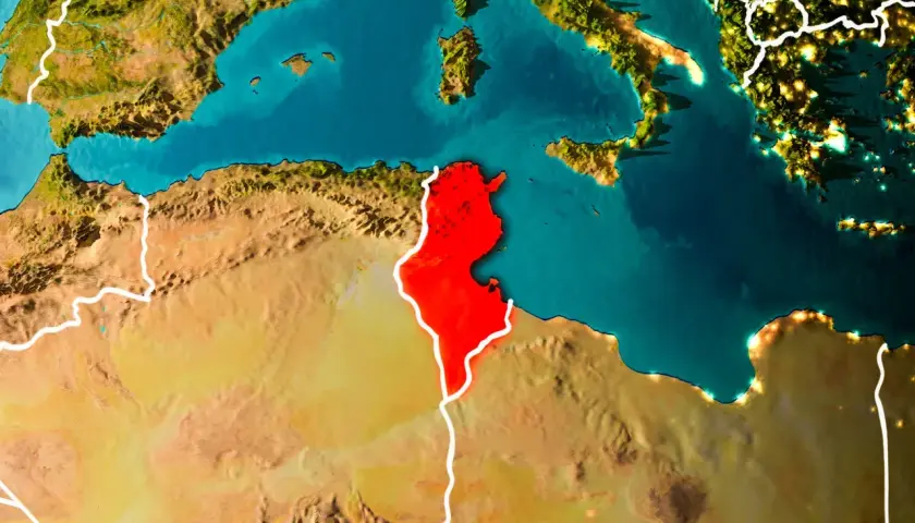 Mapa świata z zaznaczoną na czerwono Tunezją. Widoczna Europa, Morze Śródziemne i północna Afryka. Gdzie jest Tunezja? Tutaj!